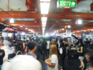 Abstract people walking in exhibition blurred background