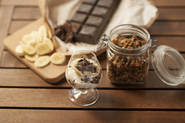 Healthy breakfast. Granola with nuts, seeds, honey, frozen raspberries pumpkin in a wooden biwk on wooden table