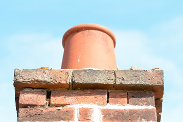 Chimney pot on top of chimney stack on roof of house