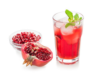 Pomegranate juice in a glass. Isolated on white background