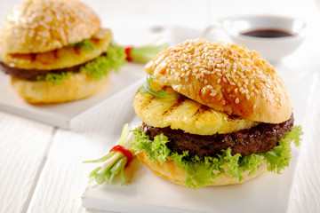 Gourmet Hawaiian Burgers Served on White Table