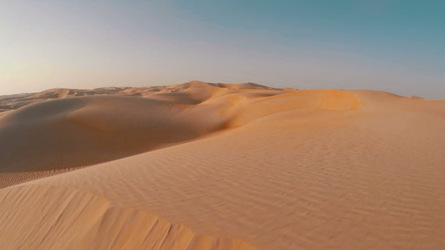 Drone shot flying close over sand dune