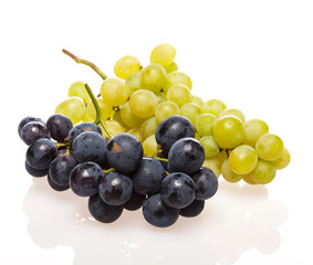 Fresh grape cluster on white with water drops