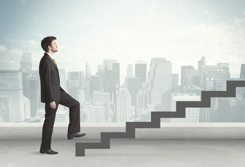 Business person in front of a staircase