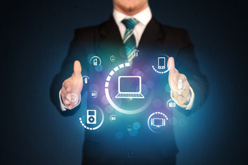 holding digital media icons