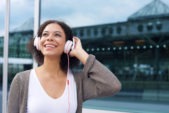 Attractive young woman smiling with headphones
