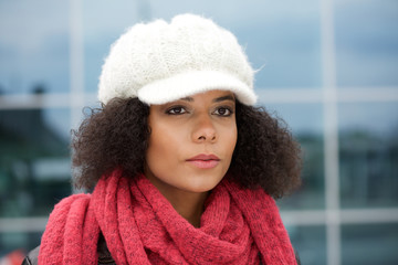 Young african american woman with winter hat and scarf