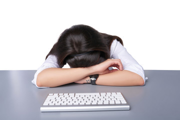 Businesswoman asleep on her laptop
