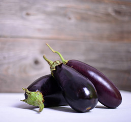 Eggplant on white wood background