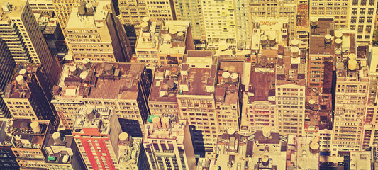 Vintage filtered panoramic view of Manhattan roofs.