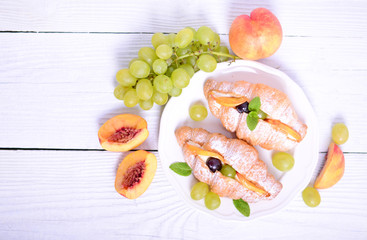 Fresh fruit croissant on white background
