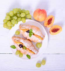 Fresh fruit croissant on white background