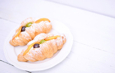 Fresh fruit croissant on white background