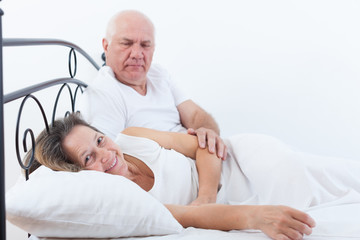 man and woman on   bed