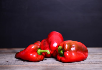 Red pepper with a huge stem on a table