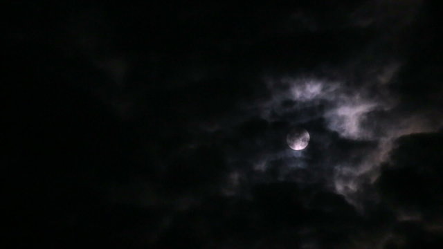 Moon, fast moving clouds