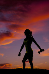 silhouette of a woman weights down side