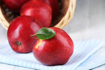 Ripe red apples on table close up