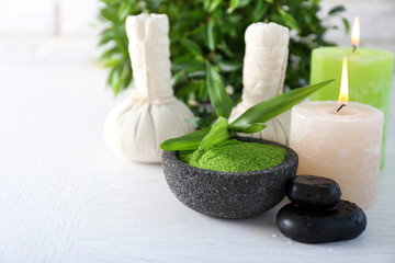 Beautiful composition of spa treatment on white wooden table