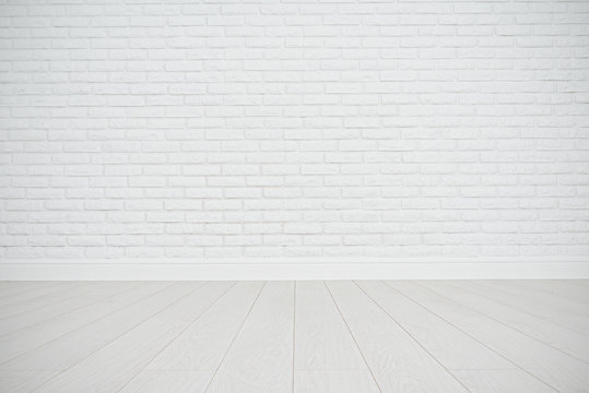 white blank brick wall and wooden floor