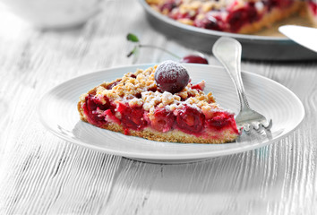 Tasty homemade pie with cherries on table close up