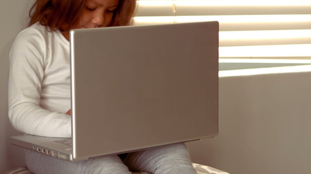 Hispanic girl on a laptop
