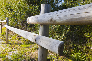 Detail of a wooden fence built with poles split in half