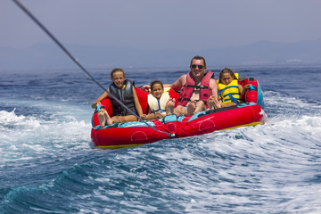 Fototapeta na wymiar Family ride on the sea