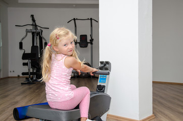 blond girl training in the gym