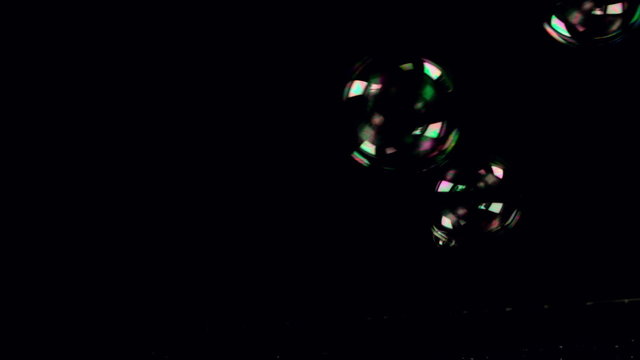 Bubbles floating on black background
