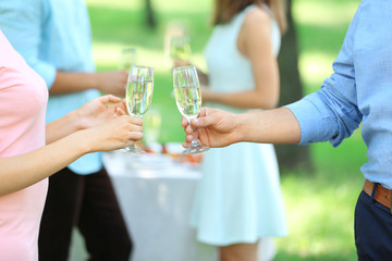 Guests drink champagne on wedding ceremony