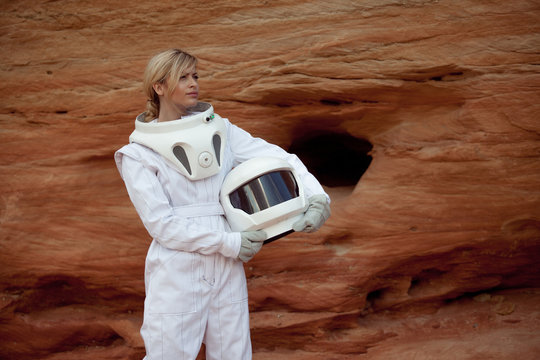 futuristic astronaut without a helmet on another planet, image