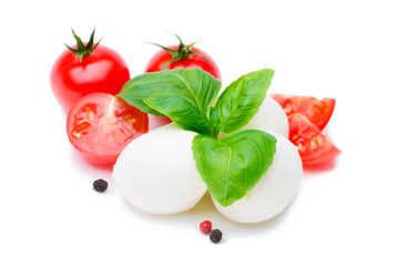 Mozzarella, tomatoes and basil leaves isolated on white
