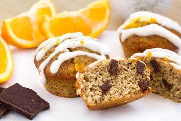 Orange and chocolate muffin with sugar syrup on top.