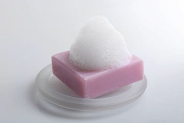 Soap with foam isolated on white