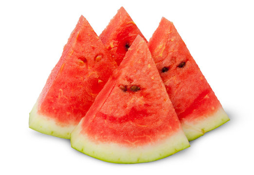 Four slices of ripe watermelon near
