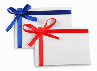 Cards decorated with bows isolated on white