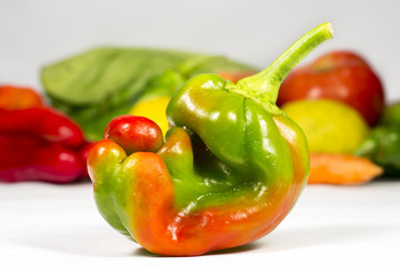  Small two-color pepper in front of other vegetables