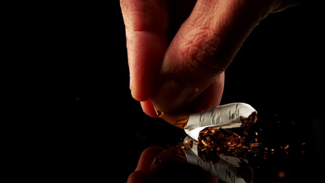 Hand smashing a cigarette