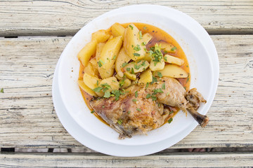 Barbecued chicken leg with boiled potatoes