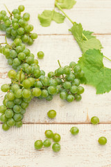 Grapes on white wooden vintage table