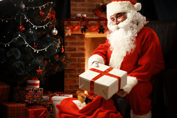 Santa Claus brought gifts for Christmas and having a rest 
