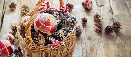 Fototapeta na wymiar Vintage Christmas Fir Tree Toys in Basket with Light effect