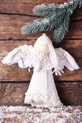 Christmas angel on wooden background