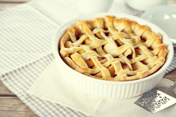 Homemade apple pie on wooden background
