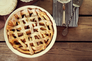 Homemade apple pie on wooden background