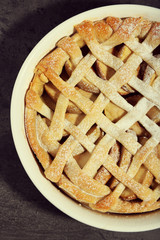Homemade apple pie on wooden background