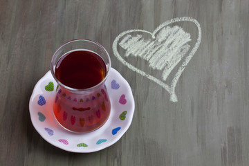 a glass of black tea