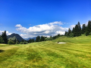 Fototapeta na wymiar Empty golf course in the high mountains