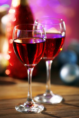 Wine and Christmas decoration on bright background